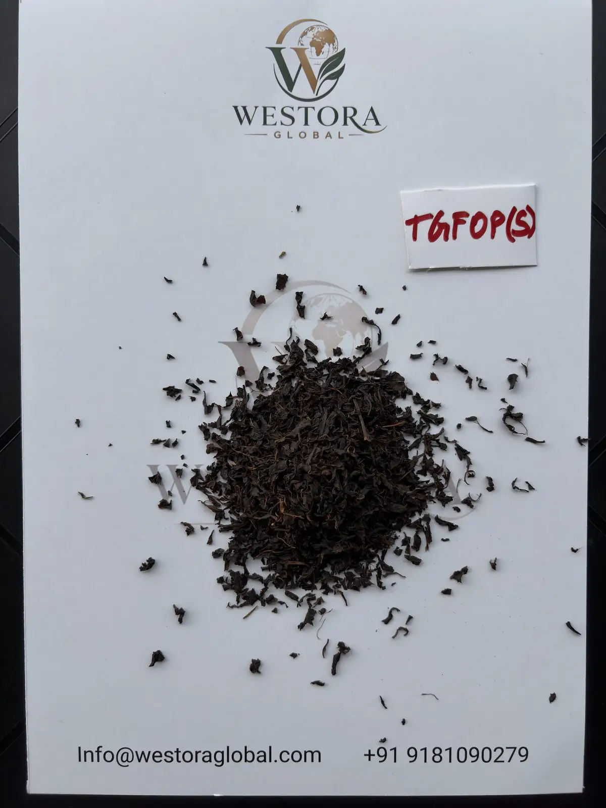 Dry Assam orthodox black tea, TGFOP(S) grade, on a Westora Global sample sheet
