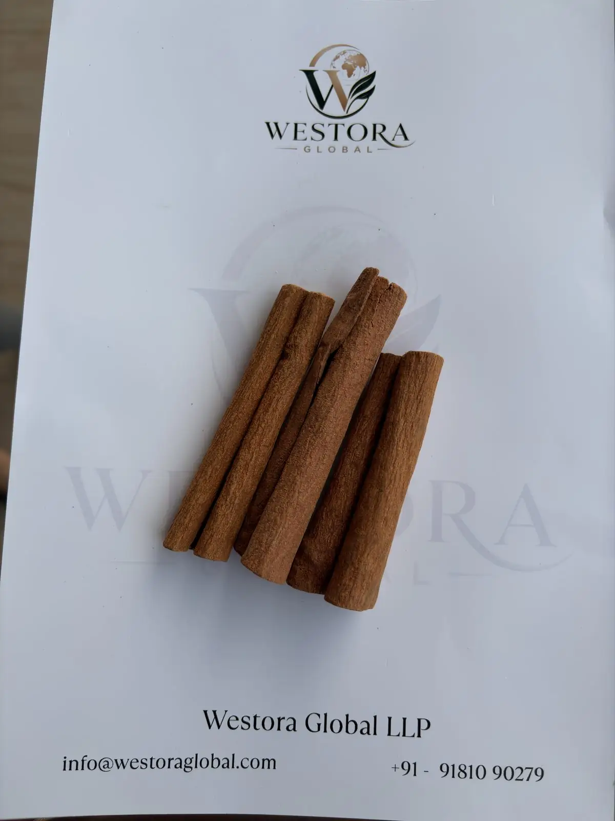 Rolled cinnamon bark quills from Northeast India on a Westora Global sample sheet